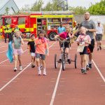 Families on the track at the Superhero Challenge